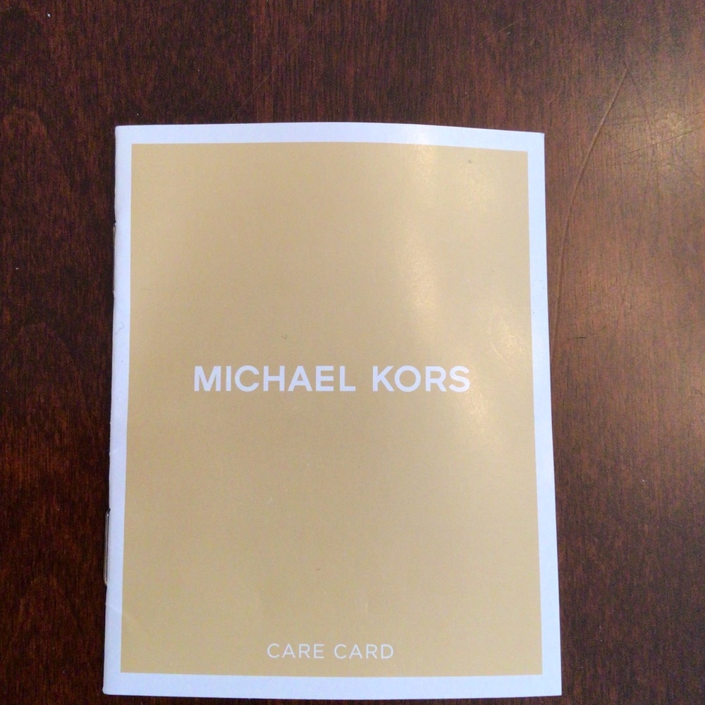 Michael Kors purse gray, 11” high, 11” wide, 3” deep, used but great condition.